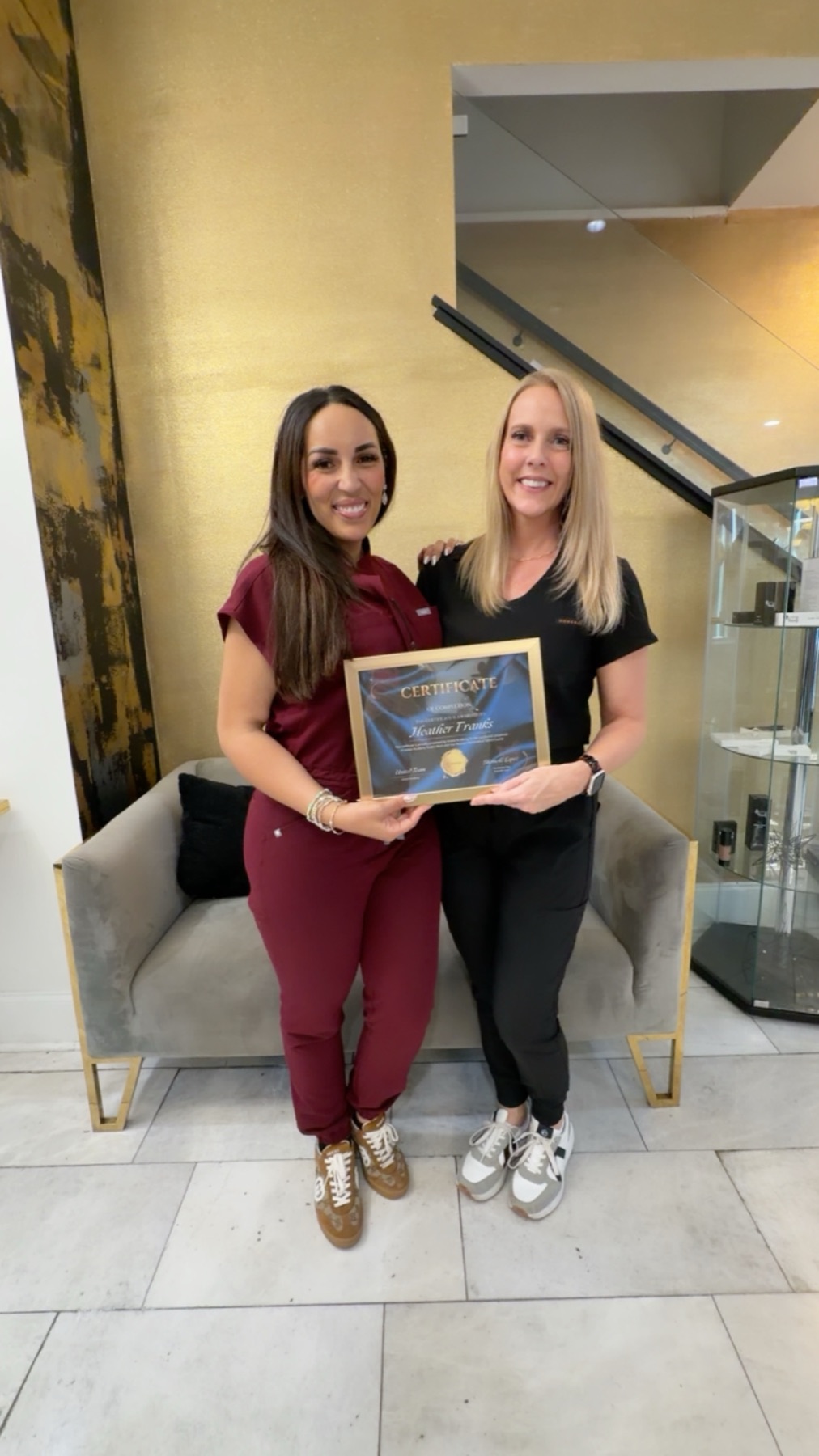 Heather Franks receiving a paramedical tattoo training certificate
